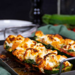 Zucchini pizza boats with goat cheese and spinach