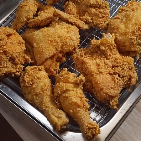 chicken fried on a metal pan cooling