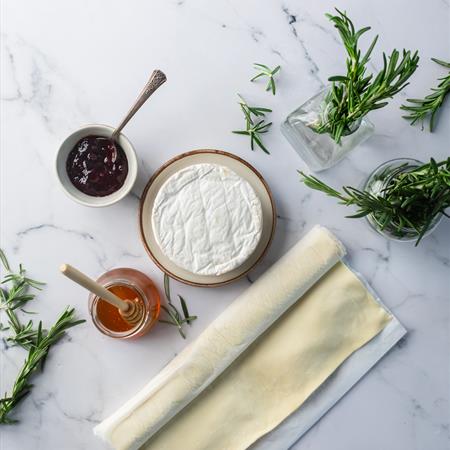 overhead of dough and ingredients on a counter-top for cranberry bites recipe