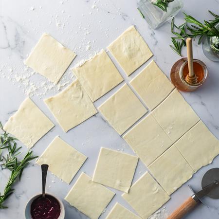 phyllo dough cut in to squares on white countertop overhead