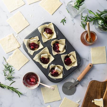 filled dough for cranberry brie bites recipe on countertop overhead