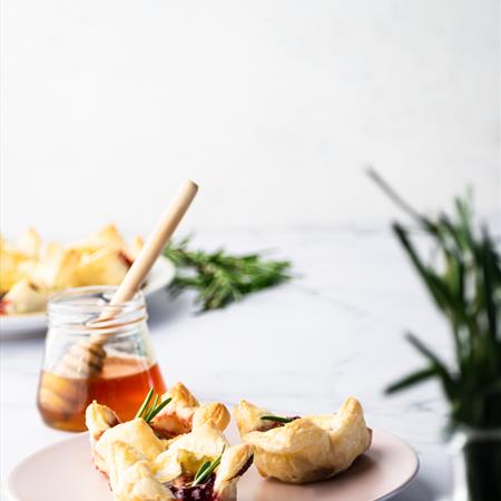 side view on cranberry brie bites on a white background