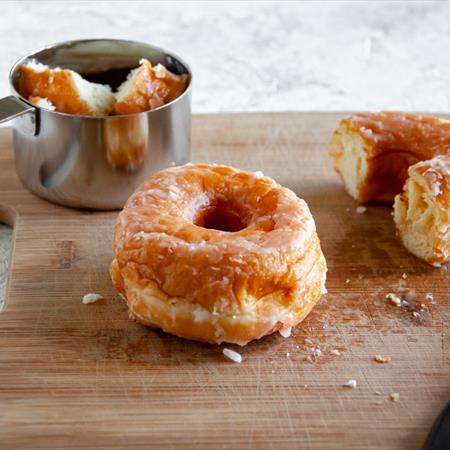 doughnut or donut on cutting board with knife