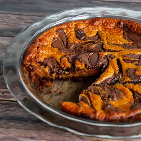 nutella pumpkin pie recipe with slice taken out from side angle